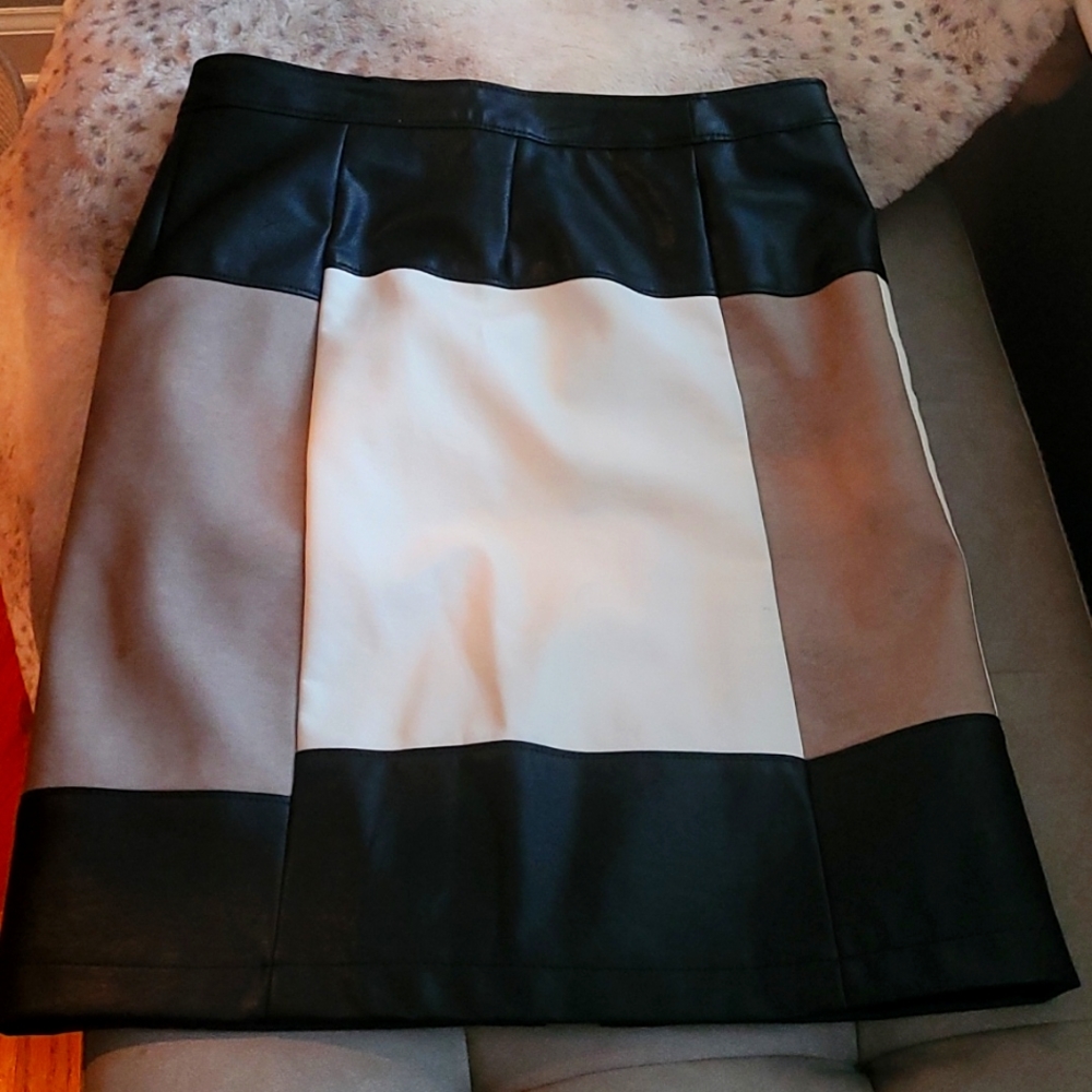 Fully lined leather skirt.